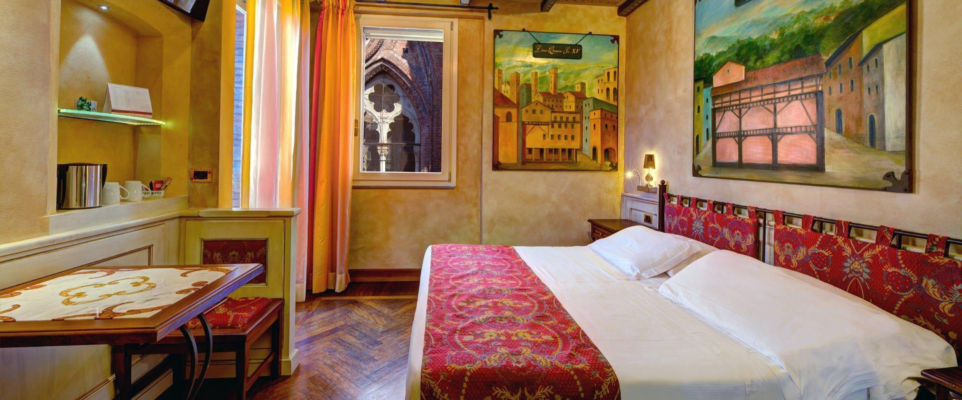 THE ALMA MATER AND THE ART HOTEL COMMERCIANTI: TWO STORIES THAT INTERTWINE  Art Hotel Commercianti Bologna THE ALMA MATER AND THE ART HOTEL COMMERCIANTI: TWO STORIES THAT INTERTWINE  Art Hotel Commercianti Bologna